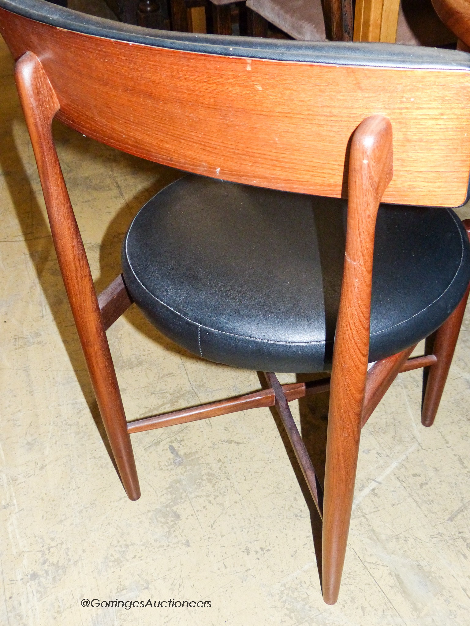 A teak and leatherette Fresco dining suite by Wilkins for G Plan, comprising circular extending dining table, 120cm diameter (166cm extended), height 73cm and four chairs